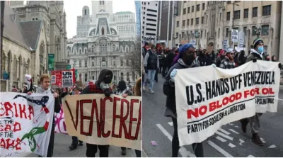 Massa demonstran berpawai dari Balai Kota Philadelphia ke Pusat Pertahanan militer AS di Spring Garden Street sambil membawa poster memprotes serangan militer Amerika Serikat di Venezuela.